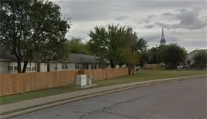 a view of street along with trees