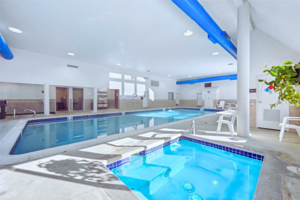 22340 Highway 6, Unit 1788 Keystone, CO 80435 - Photo 2 of 21 a living room with furniture and a dining table with kitchen view