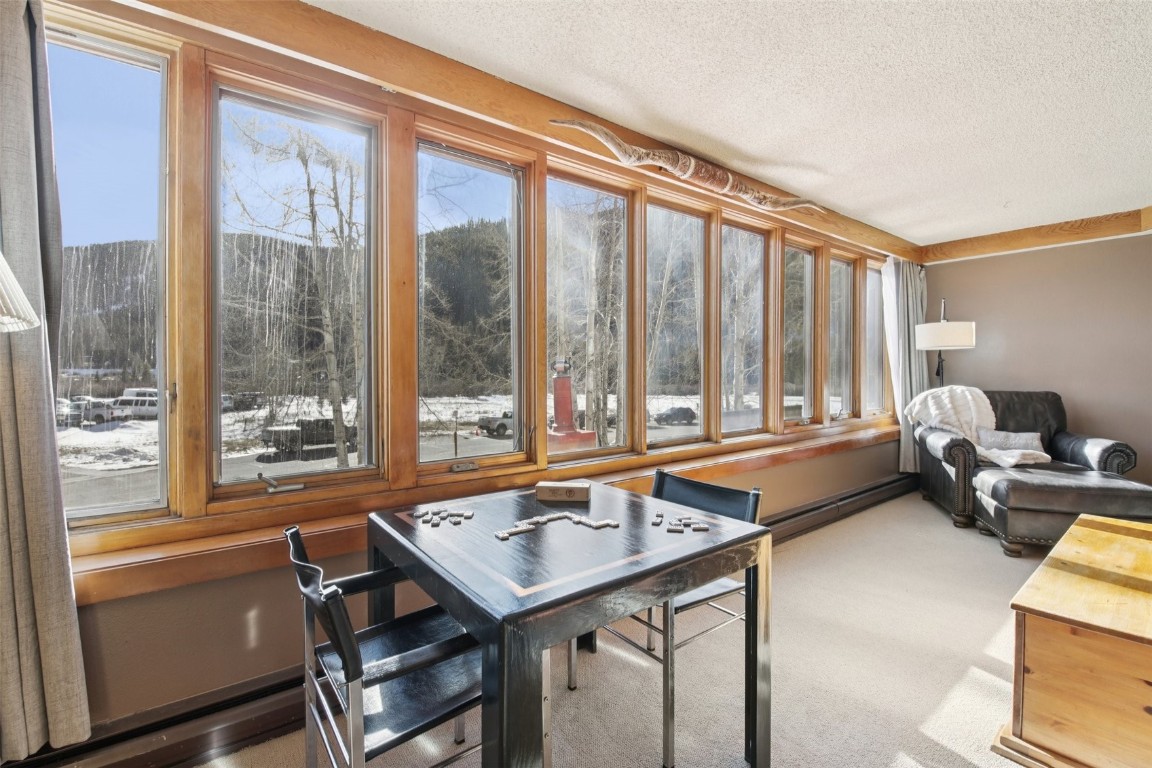 22340 Highway 6, Unit 1788 Keystone, CO 80435 - Photo 6 of 21 a very nice looking living room with a large window and a table