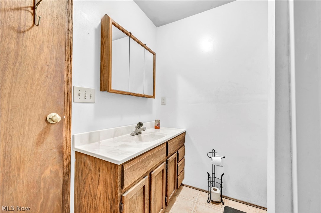 4560 Arrow Road Northwest Carrollton, OH 44615 - Photo 13 of 41 Bathroom featuring tile flooring and vanity