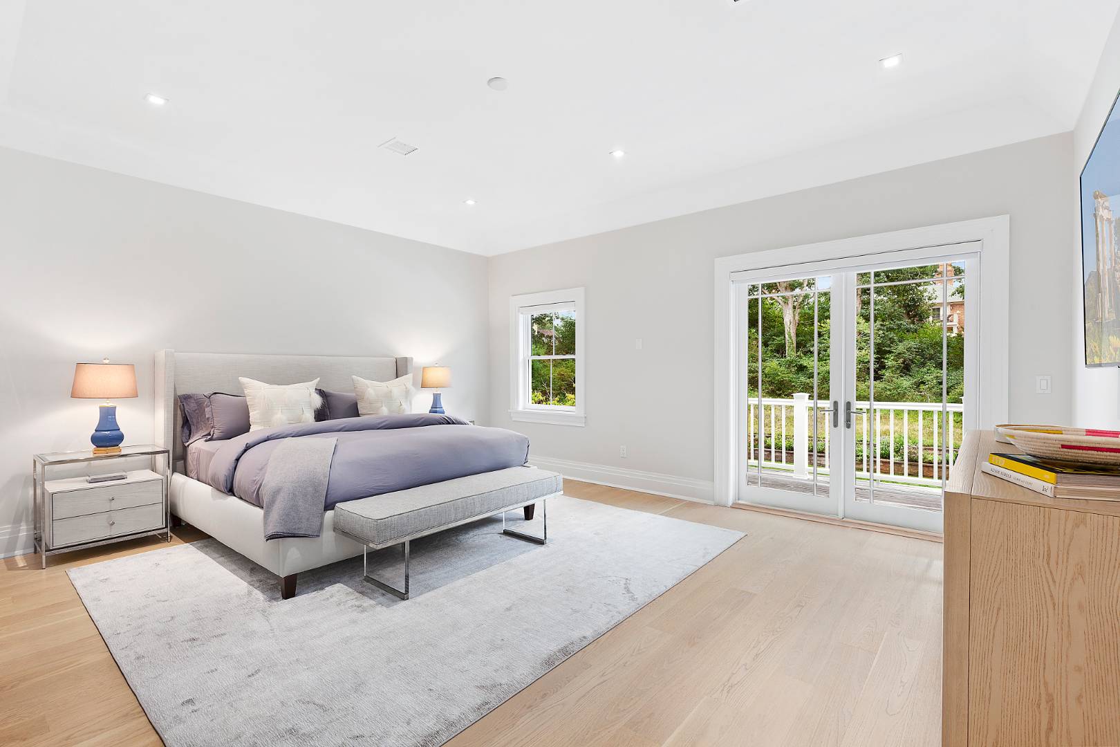 8 Shady Pth Bridgehampton, NY 11963 - Photo 17 of 30 a bedroom with a large bed and a large window