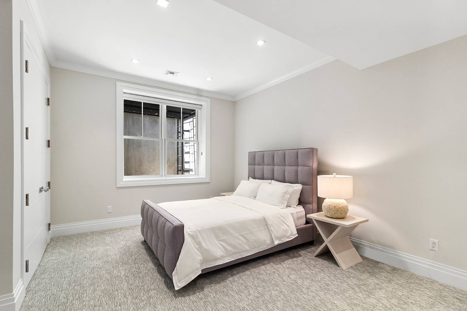 8 Shady Pth Bridgehampton, NY 11963 - Photo 27 of 30 a bedroom with a bed and a window