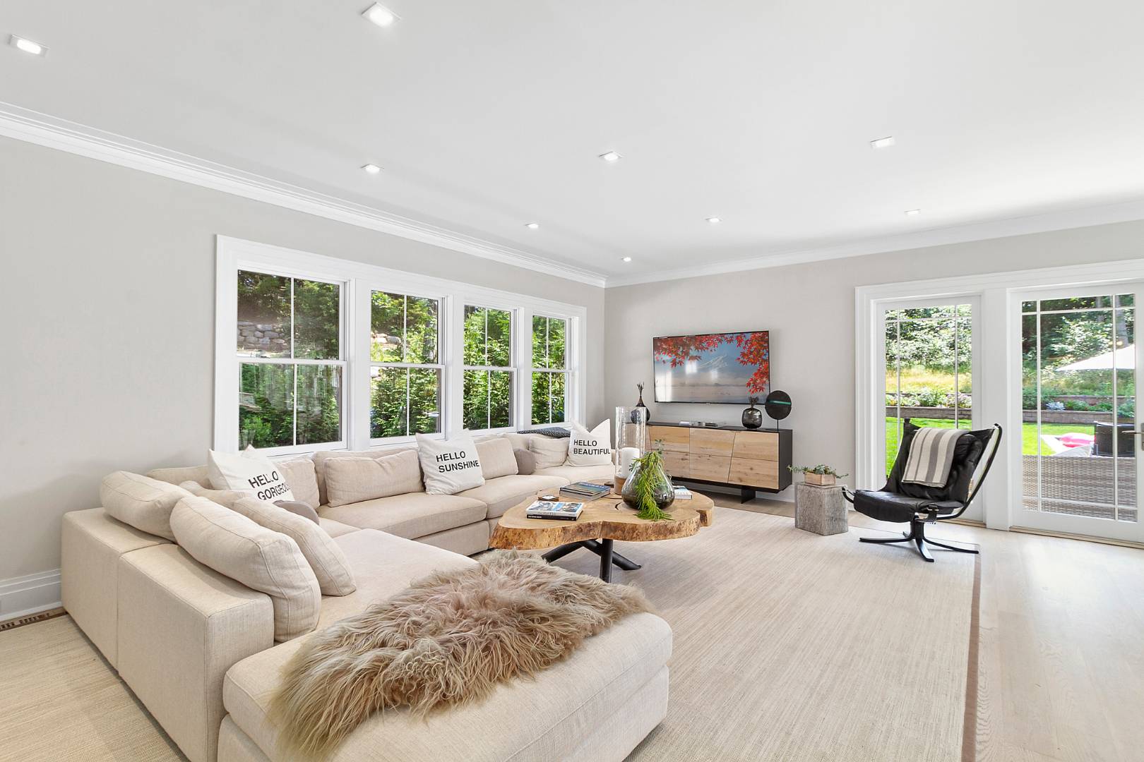 8 Shady Pth Bridgehampton, NY 11963 - Photo 9 of 30 a living room with furniture and a flat screen tv