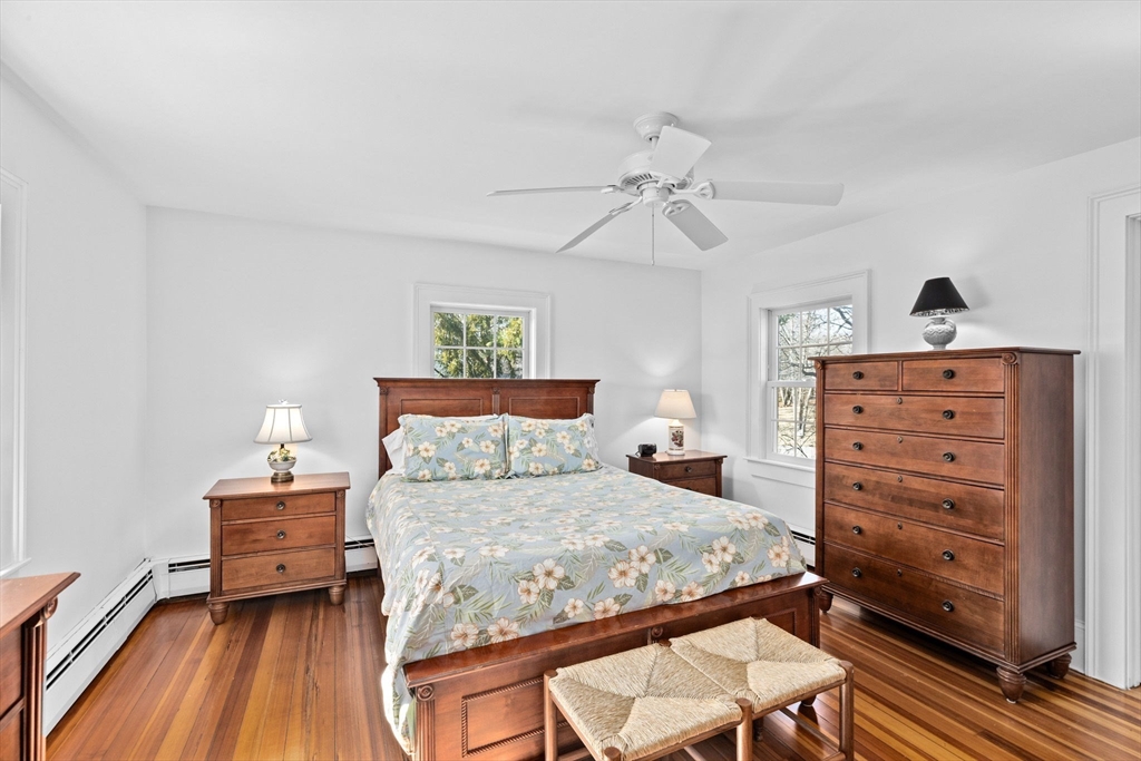 59 Gannett Road Scituate, MA 02066 - Photo 16 of 40 a bedroom with a bed and a dresser