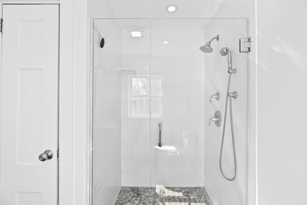 59 Gannett Road Scituate, MA 02066 - Photo 17 of 40 a bathroom with a granite countertop shower