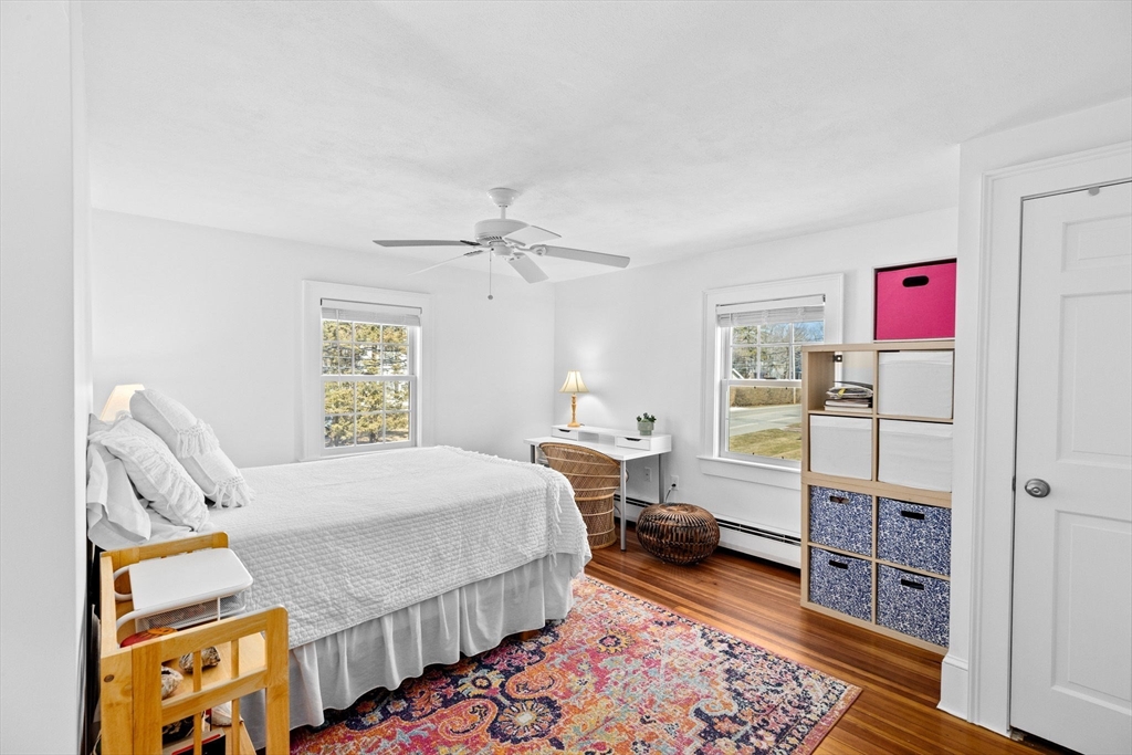 59 Gannett Road Scituate, MA 02066 - Photo 22 of 40 a bedroom with a bed and a dresser