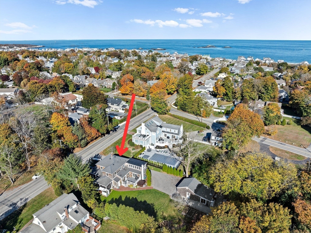 59 Gannett Road Scituate, MA 02066 - Photo 37 of 40 an aerial view of a house with a yard and lake view