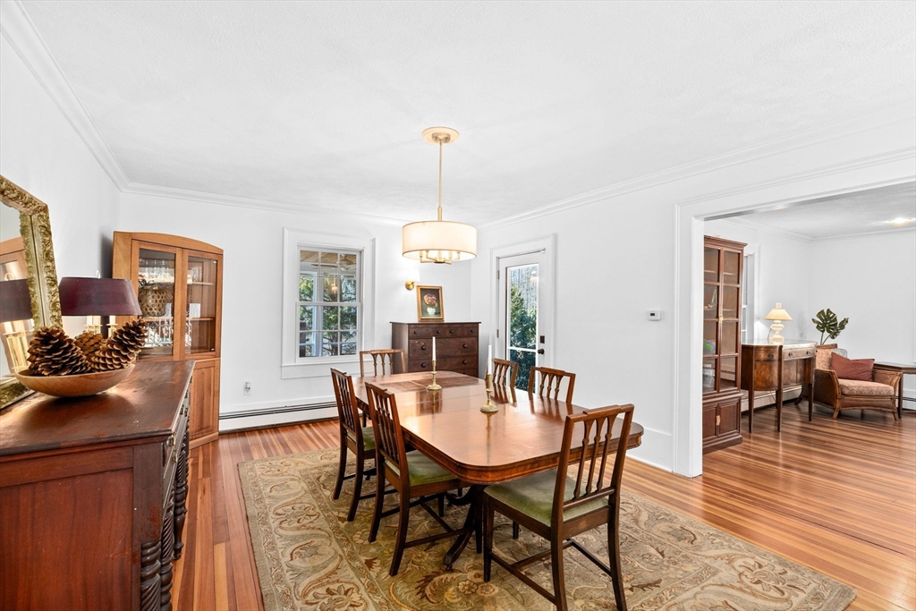 59 Gannett Road Scituate, MA 02066 - Photo 9 of 40 a view of a dining room with furniture window and wooden floor