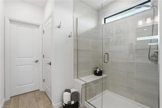 a bathroom with a bathtub and a shower