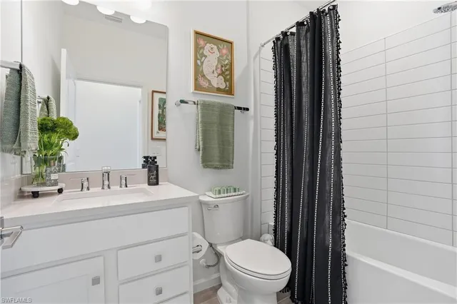 a bathroom with a toilet a sink and a bathtub