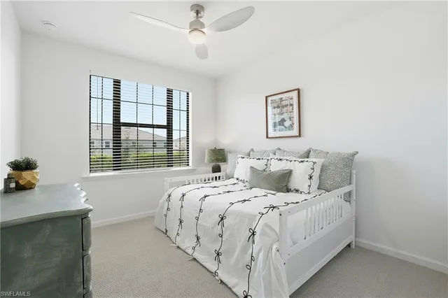 a bed room with a bed and a window