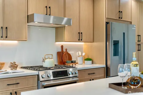 a kitchen with a stove and a sink