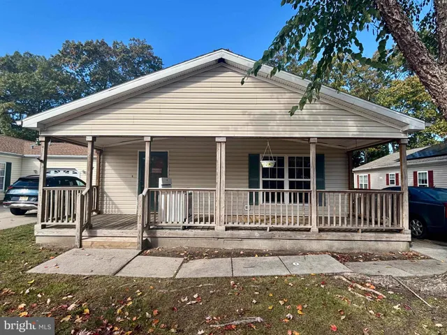 a front view of a house with a porch