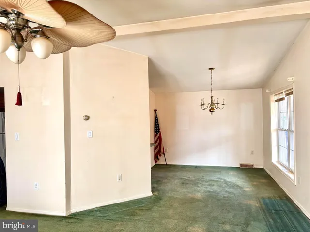 a view of a hallway with a chandelier