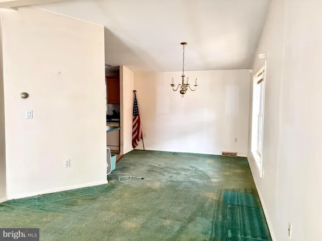 a view of a bathroom with a sink and a window