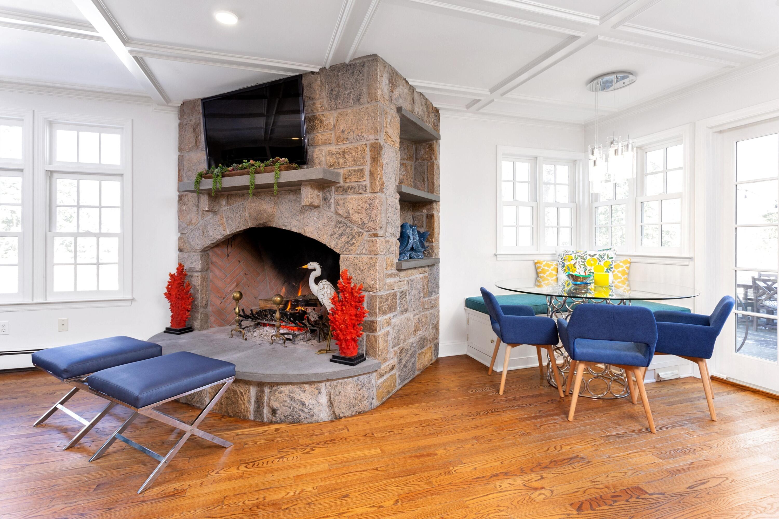 36 Sunset Road Darien, CT 06820 - Photo 12 of 38 a living room with furniture a fireplace and a flat screen tv