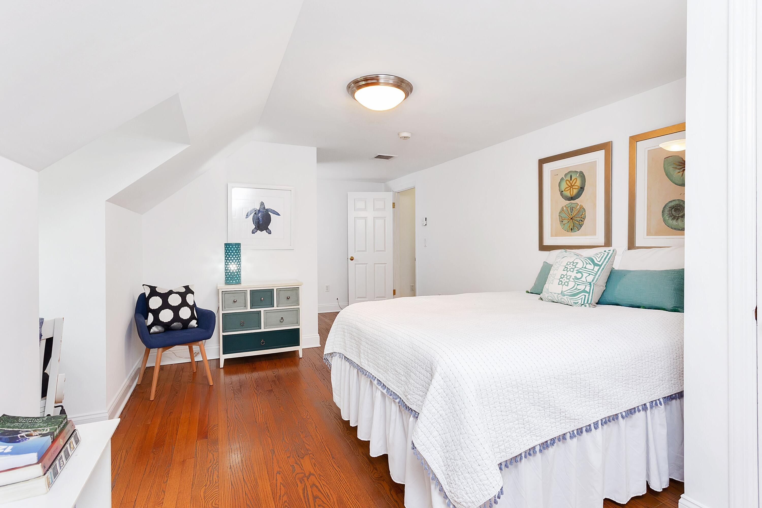 36 Sunset Road Darien, CT 06820 - Photo 23 of 38 a bedroom with a bed and a table