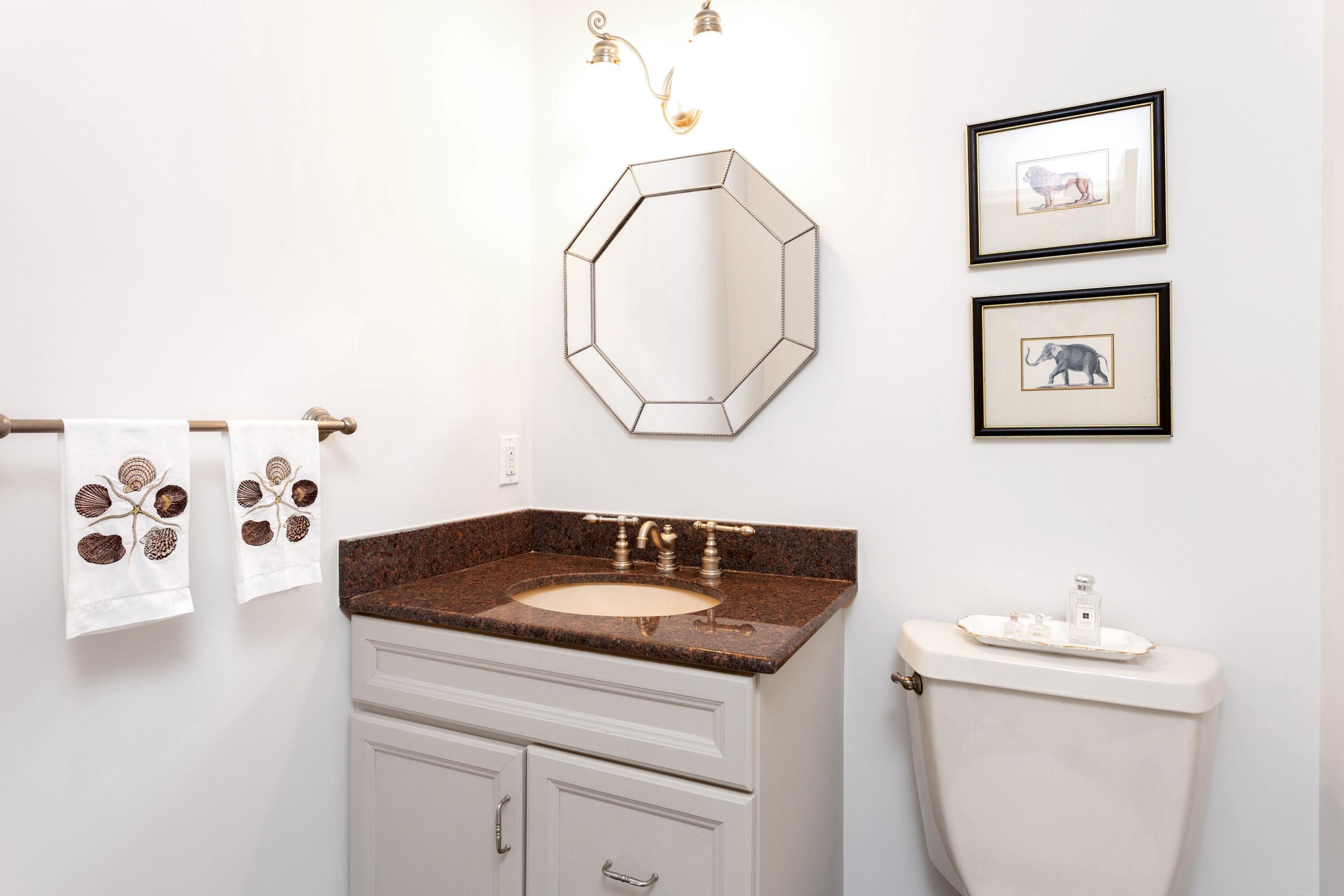 36 Sunset Road Darien, CT 06820 - Photo 25 of 38 a bathroom with a sink and a mirror