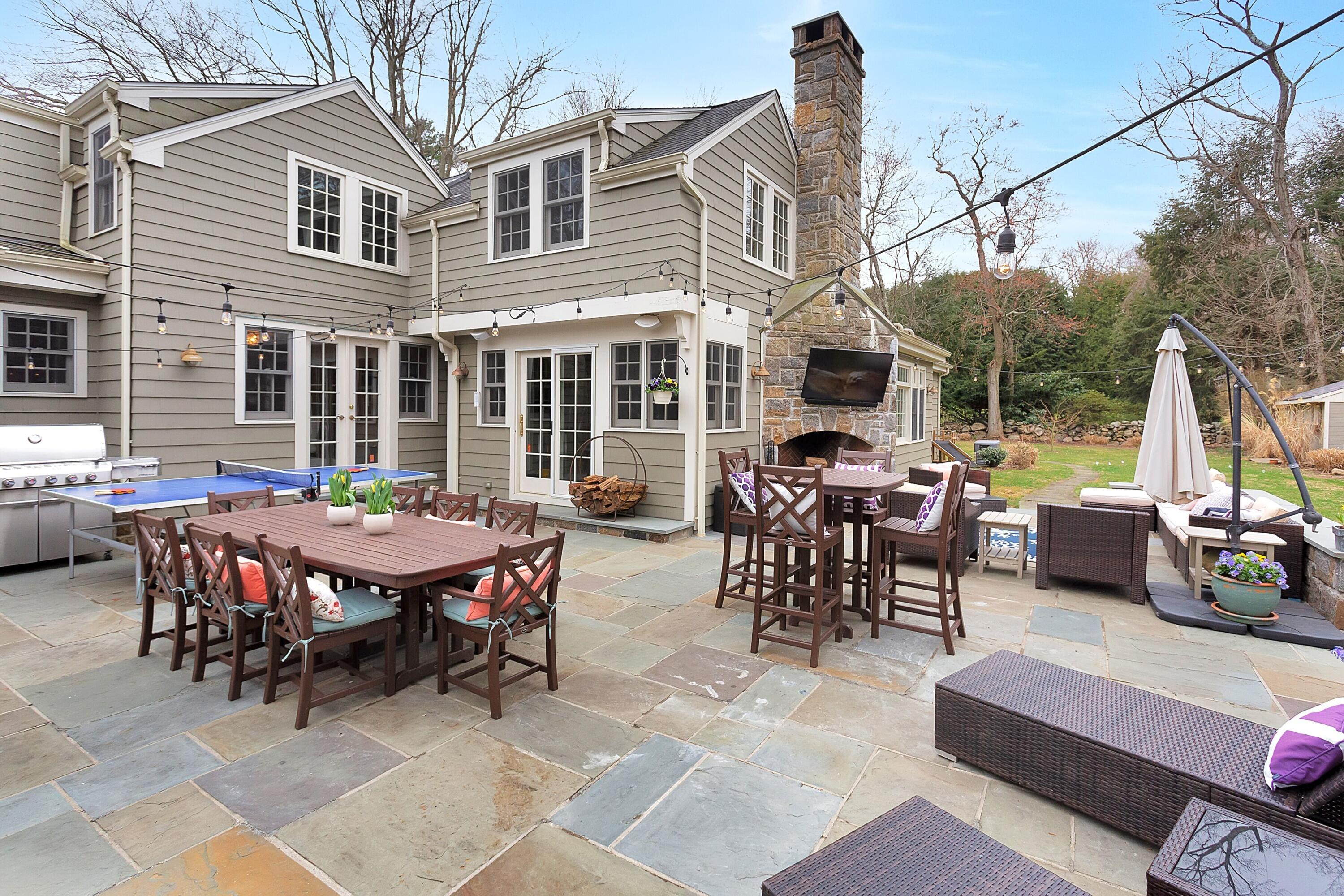 36 Sunset Road Darien, CT 06820 - Photo 31 of 38 a view of a patio with table and chairs