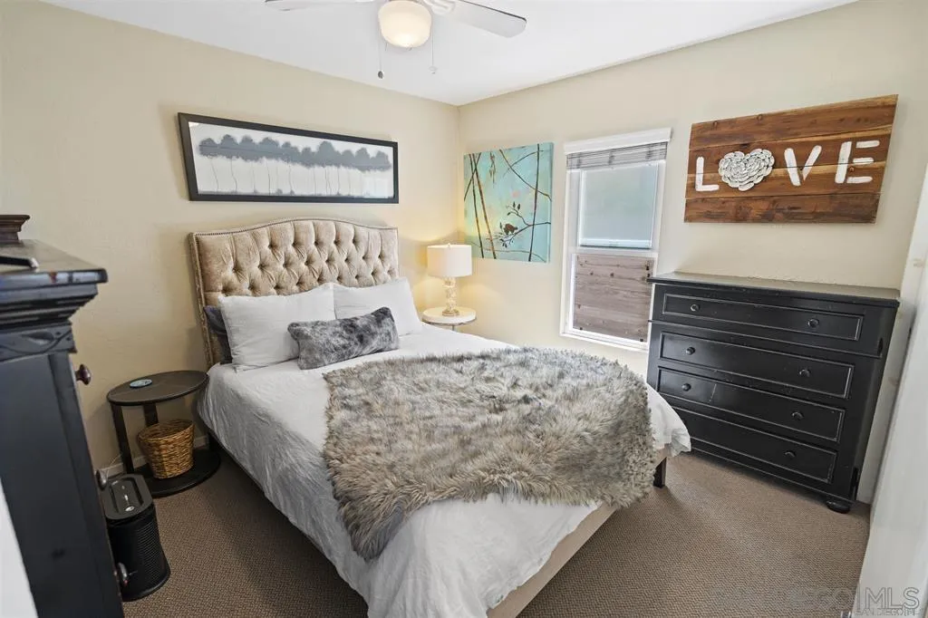 353 3rd Street Encinitas, CA 92024 - Photo 15 of 33 a bedroom with bed and wooden floor