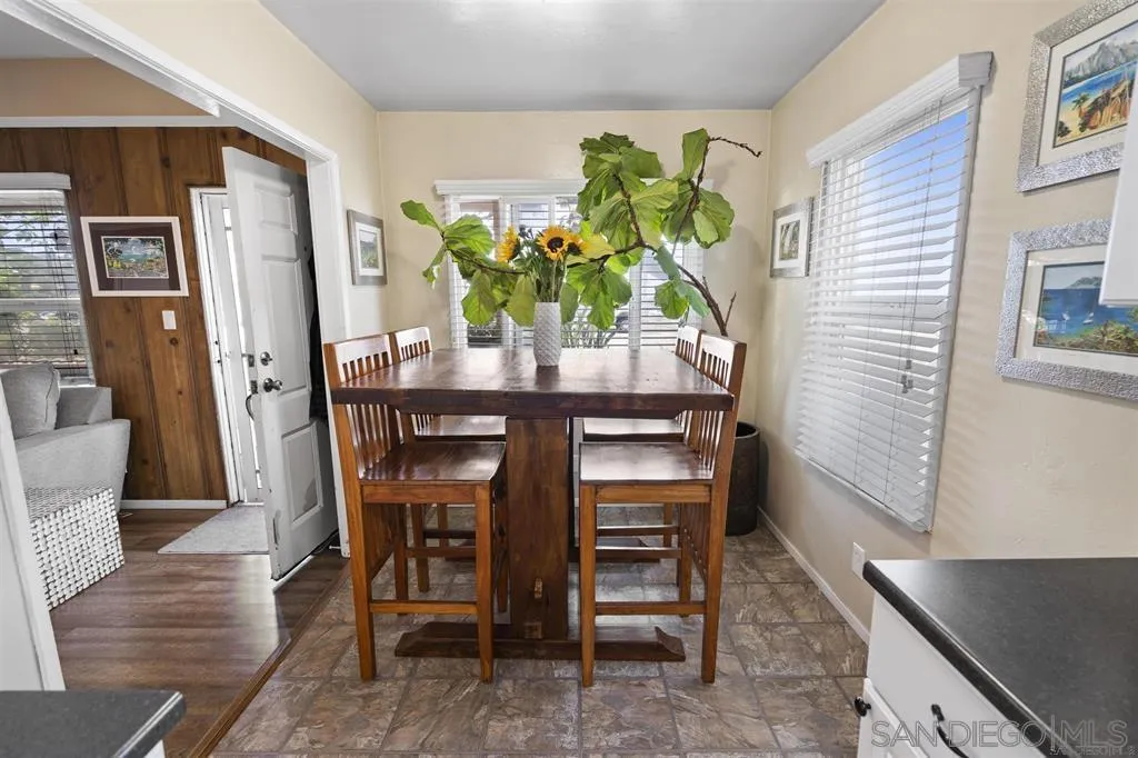 353 3rd Street Encinitas, CA 92024 - Photo 21 of 33 a dining room filled chandelier and wooden floor