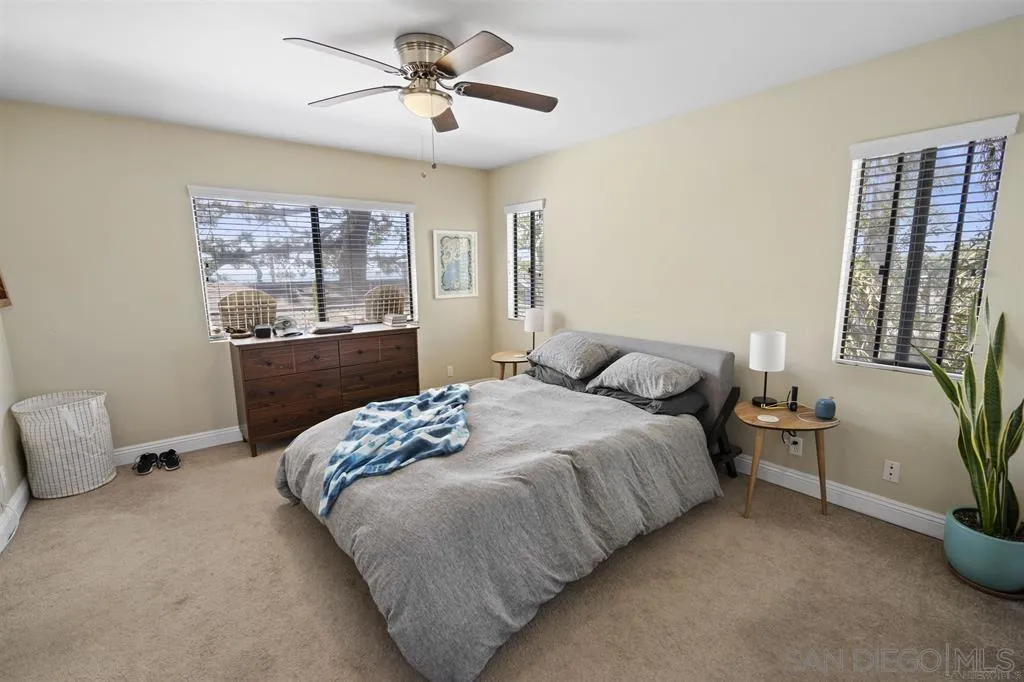 353 3rd Street Encinitas, CA 92024 - Photo 26 of 33 a bedroom with a bed and wooden floor