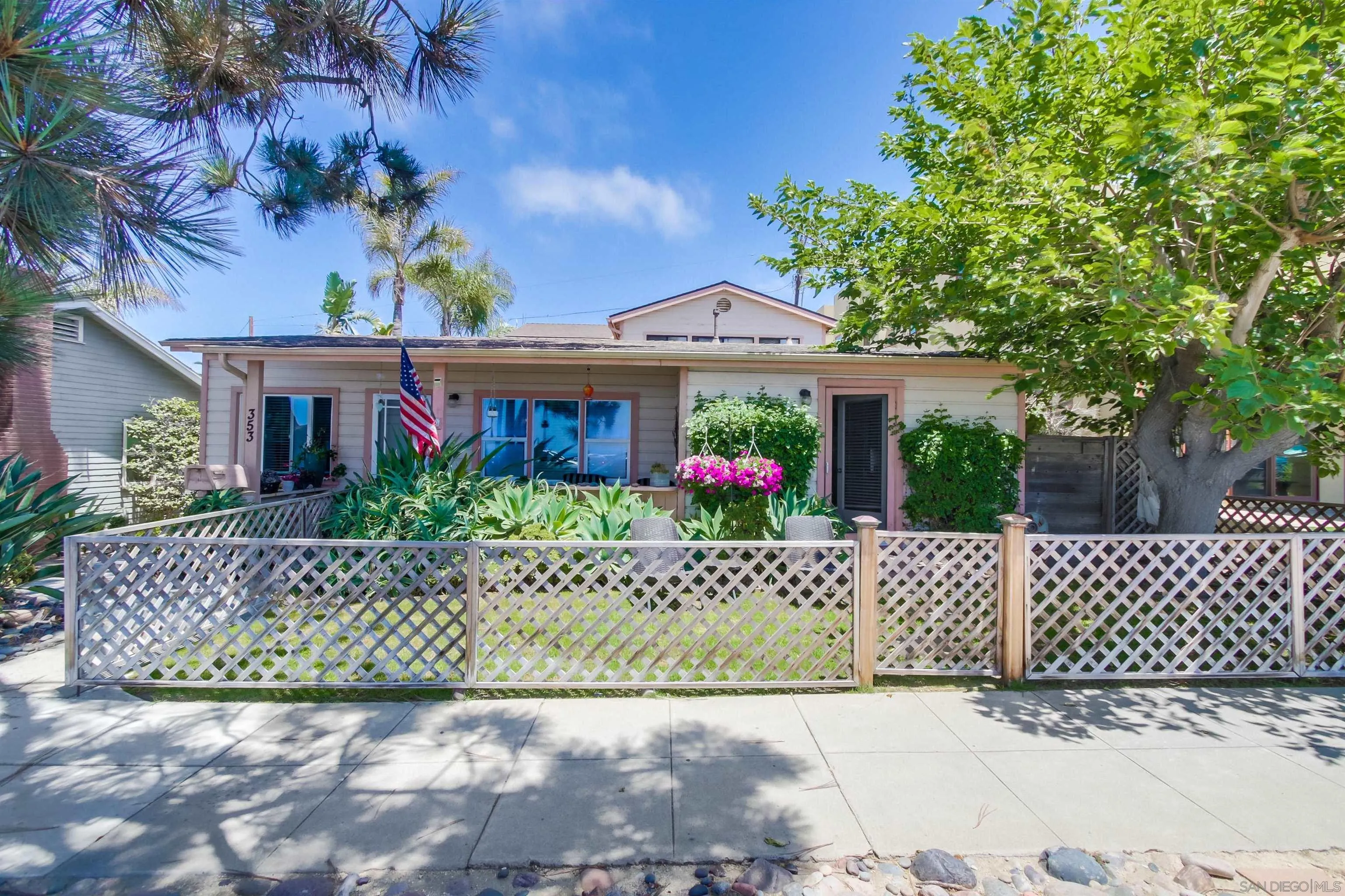 353 3rd Street Encinitas, CA 92024 - Photo 4 of 33 a front view of a house with a garden