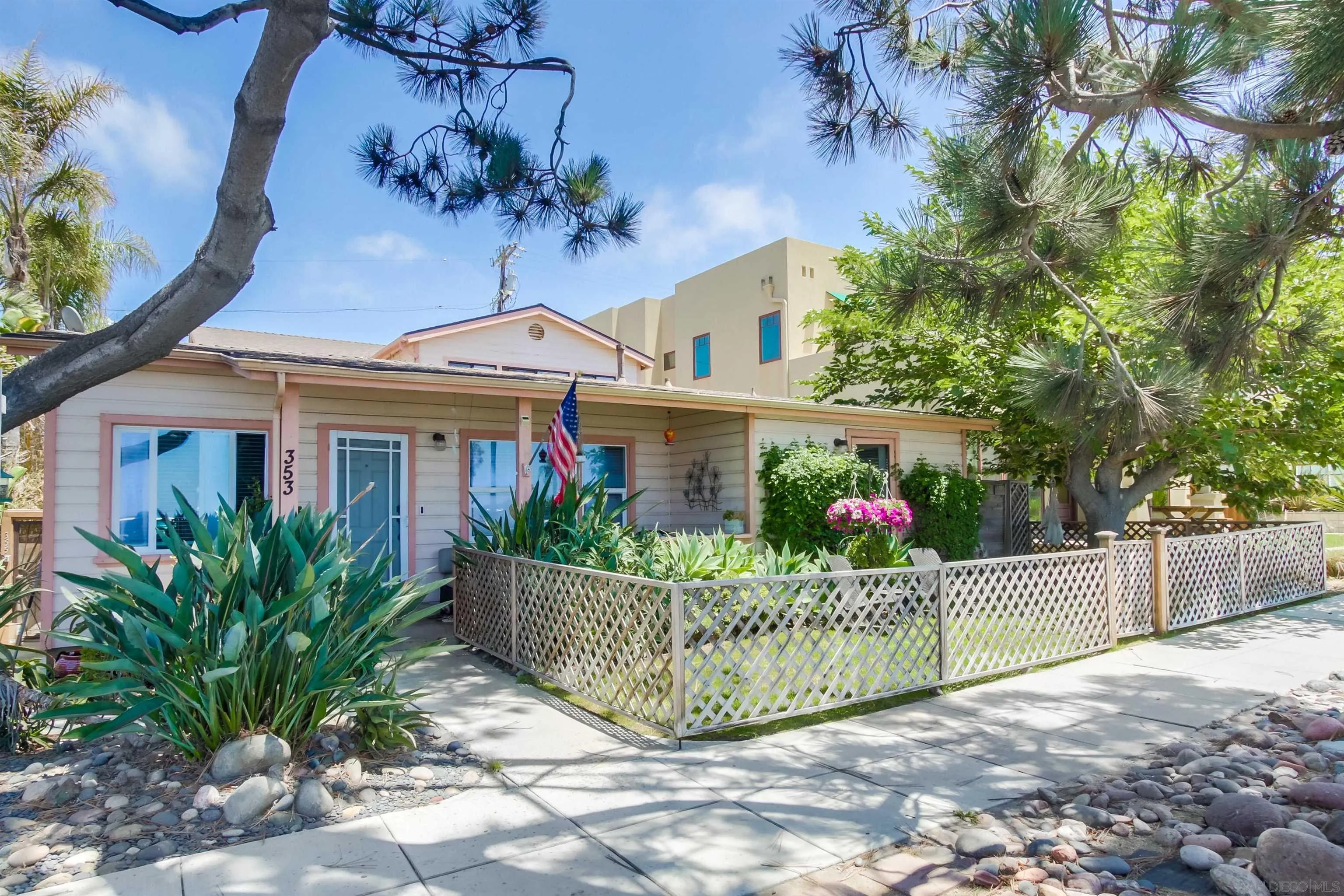 353 3rd Street Encinitas, CA 92024 - Photo 5 of 33 a view of a house with a small yard and plants