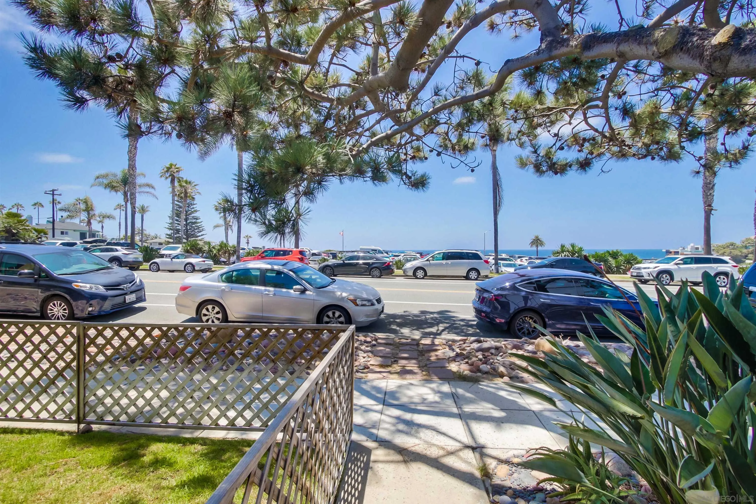 353 3rd Street Encinitas, CA 92024 - Photo 6 of 33 a view of a lake with couches and wooden fence