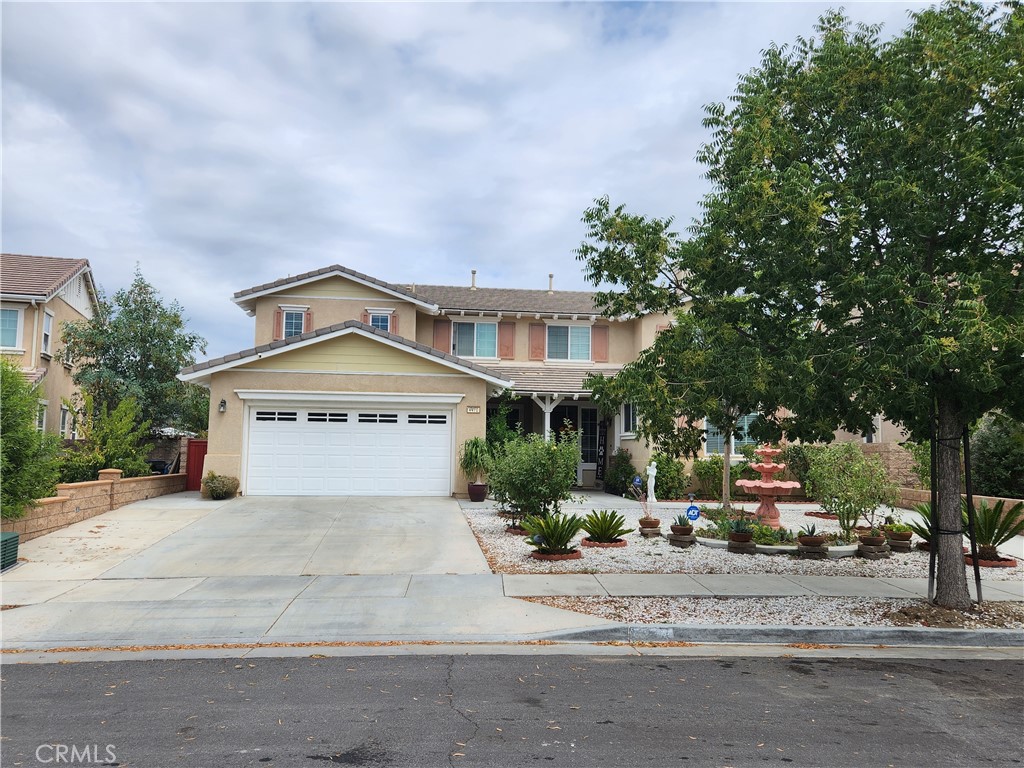 4470 Duskywing Road Hemet, CA 92545 - Photo 1 of 1 a front view of a house with a yard and garage