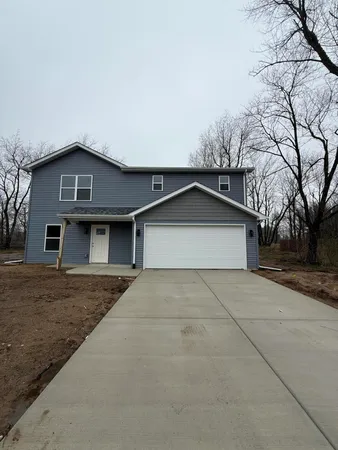 a front view of a house with yard