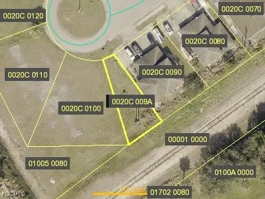 a big yard with lots of green space and house in the back