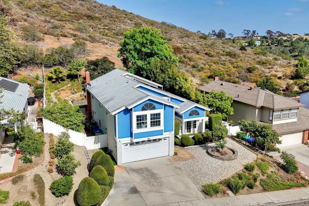 13639 Freeport Road San Diego, CA 92129 - Photo 31 of 44 an aerial view of a house with a yard and mountain view in back