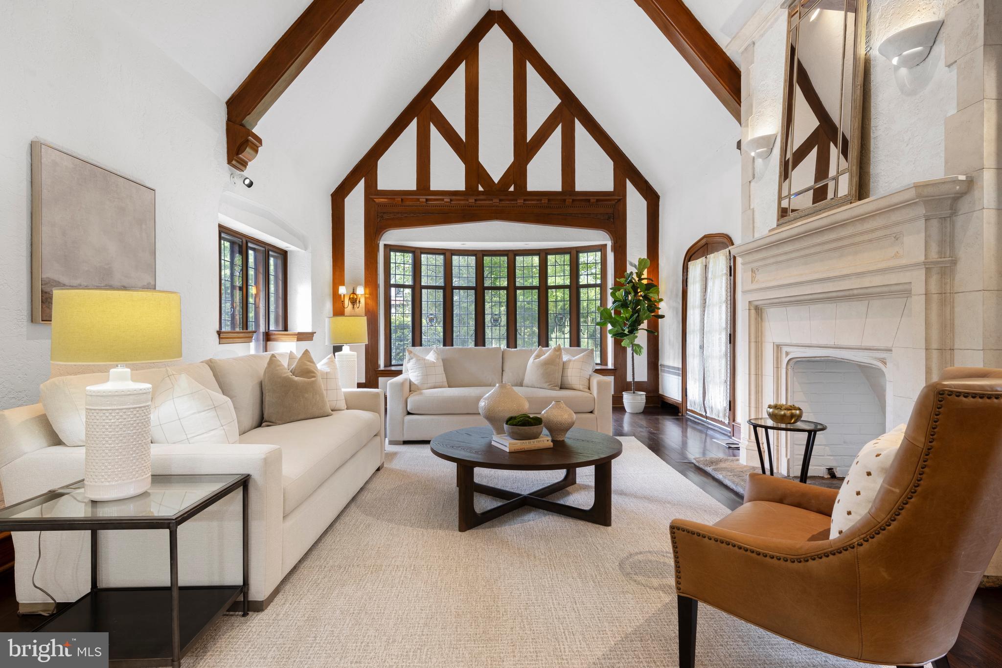 857 Meetinghouse Road Rydal, PA 19046 - Photo 13 of 93 a living room with furniture and a floor to ceiling window