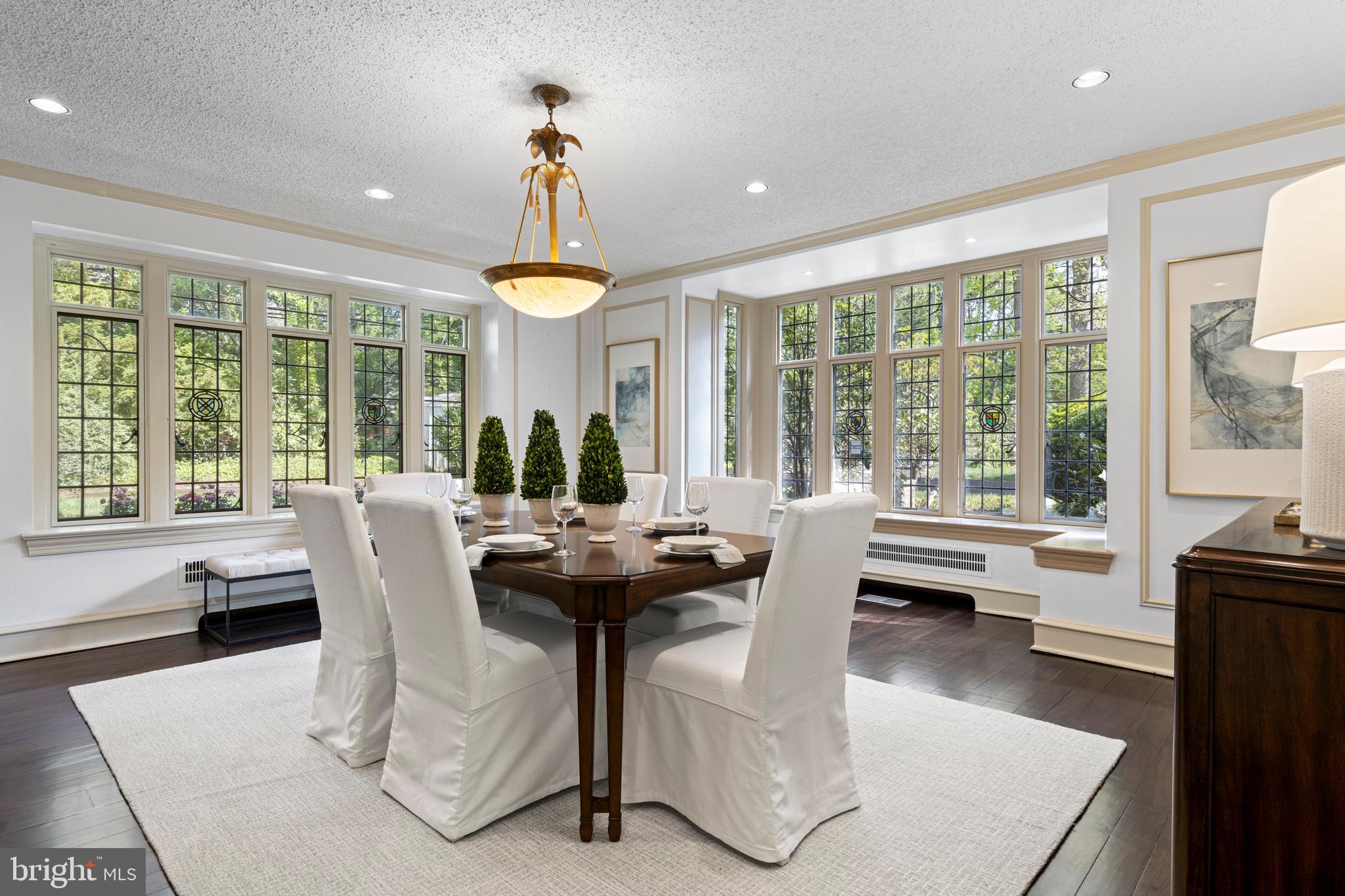 857 Meetinghouse Road Rydal, PA 19046 - Photo 17 of 93 a dining room with furniture a chandelier and wooden floor