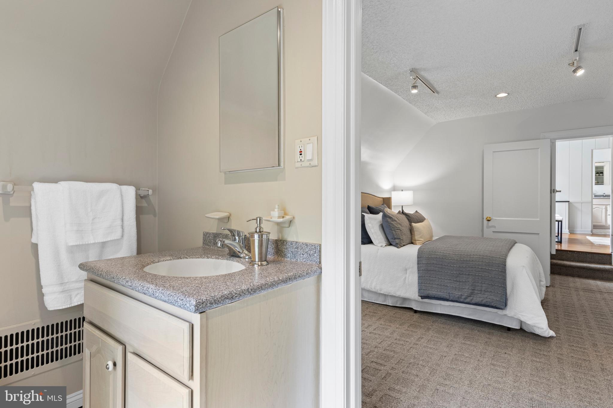 857 Meetinghouse Road Rydal, PA 19046 - Photo 51 of 93 a en suite bathroom with a granite countertop sink and a mirror