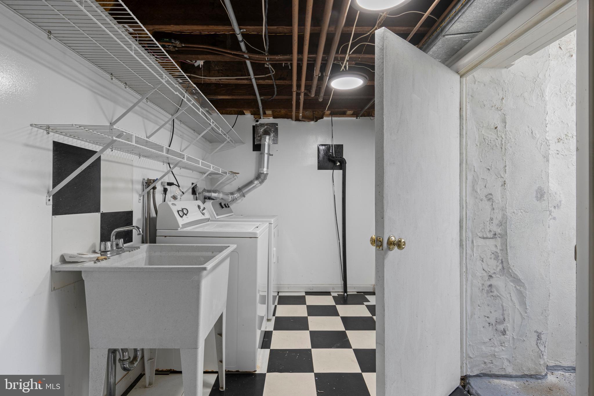 857 Meetinghouse Road Rydal, PA 19046 - Photo 61 of 93 a kitchen with a refrigerator a sink and cabinets