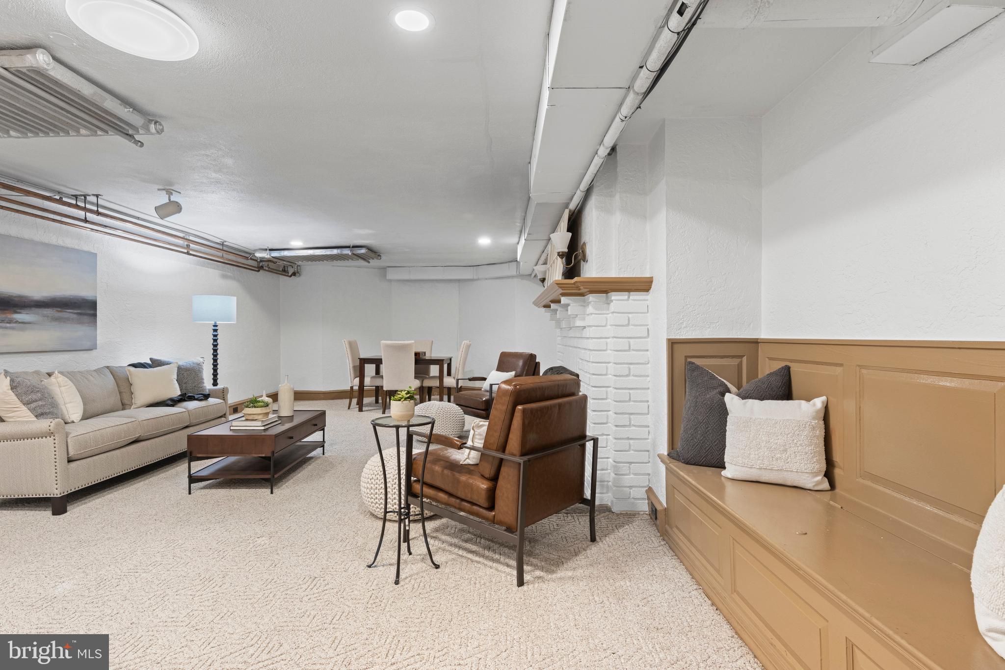 857 Meetinghouse Road Rydal, PA 19046 - Photo 62 of 93 a living room with furniture and a chandelier