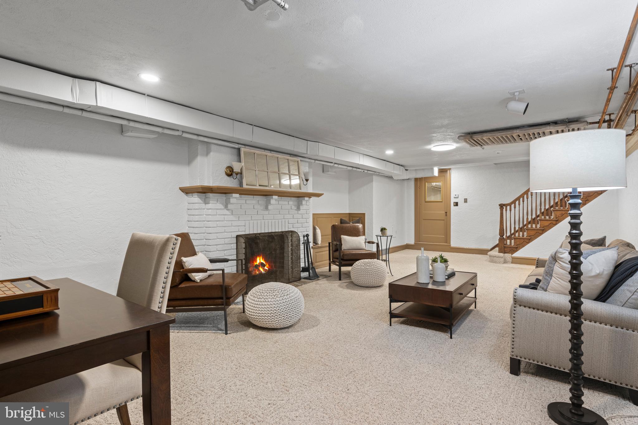 857 Meetinghouse Road Rydal, PA 19046 - Photo 63 of 93 a living room with furniture a fireplace and a flat screen tv