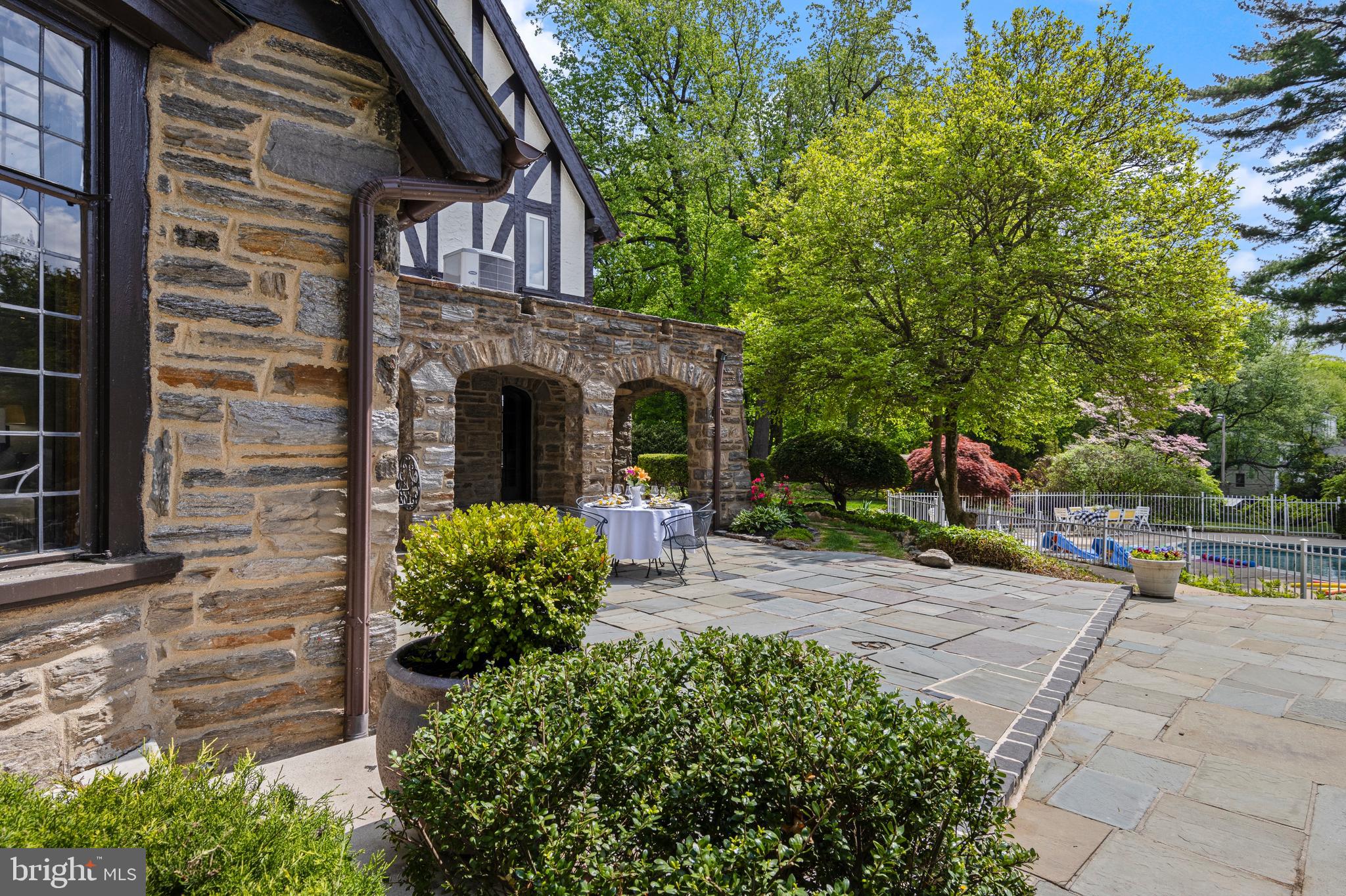857 Meetinghouse Road Rydal, PA 19046 - Photo 81 of 93 a view of a brick house with plants and large tree
