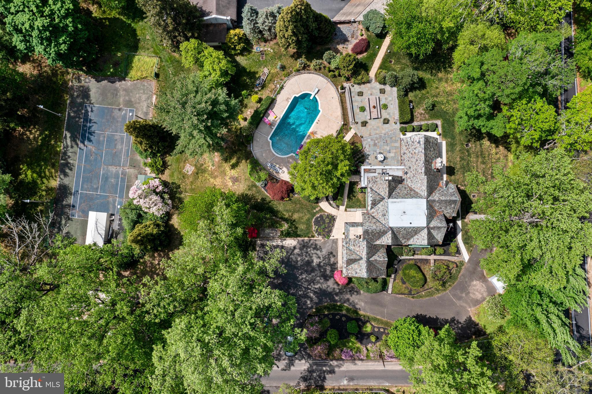 857 Meetinghouse Road Rydal, PA 19046 - Photo 93 of 93 an aerial view of a house with a yard and tennis court