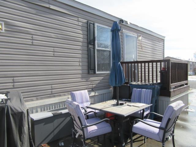 3251 E Road, Unit 99 Clifton, CO 81520 - Photo 25 of 25 a roof deck with a table and chairs