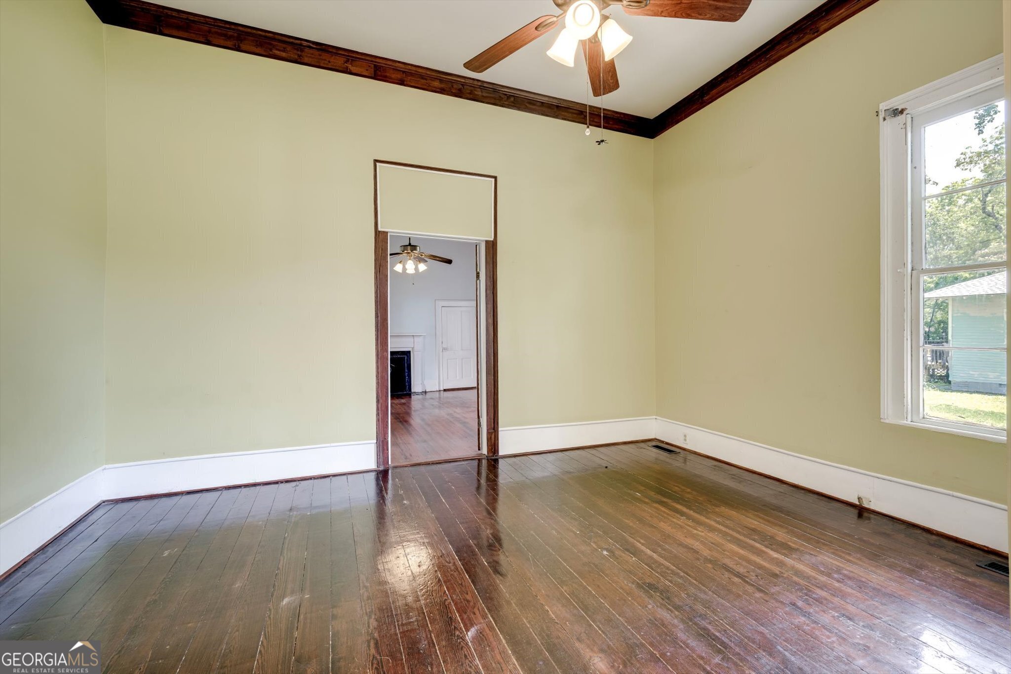 314 White Oak Street Thomson, GA 30824 - Photo 10 of 14 a view of empty room with wooden floor and fan