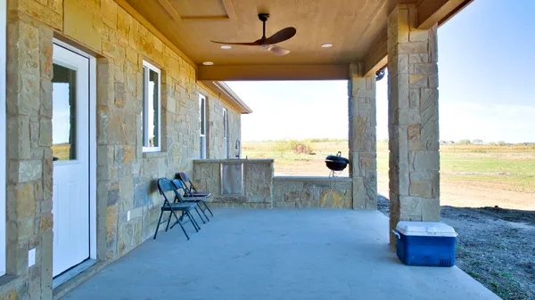 a view of living room with furniture and floor to ceiling window