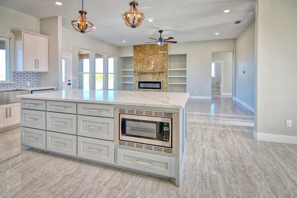 a kitchen with a stove oven and a sink