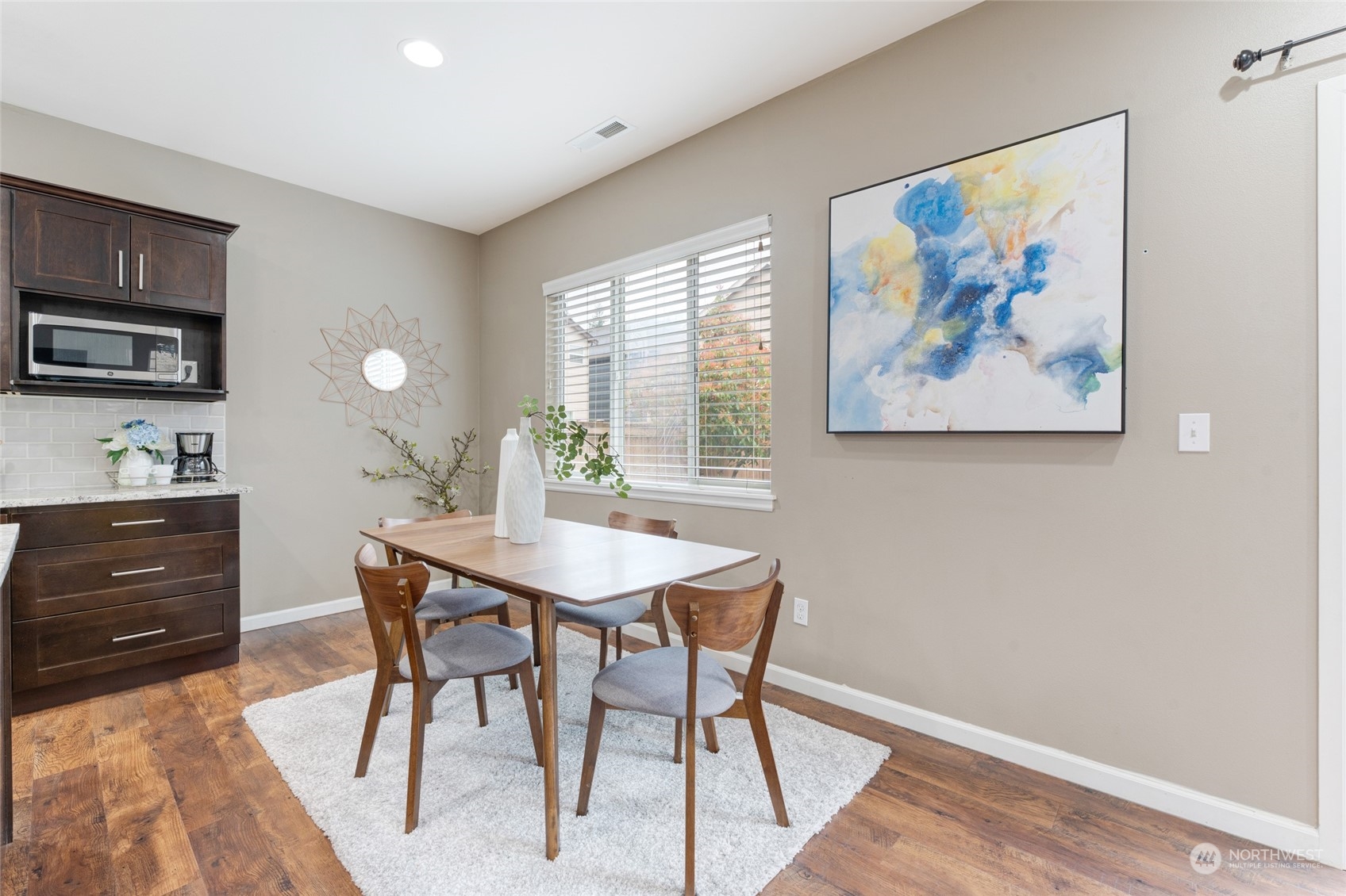 3026 183rd Street Southeast Bothell, WA 98012 - Photo 11 of 39 a view of a dining room that has a table and chairs