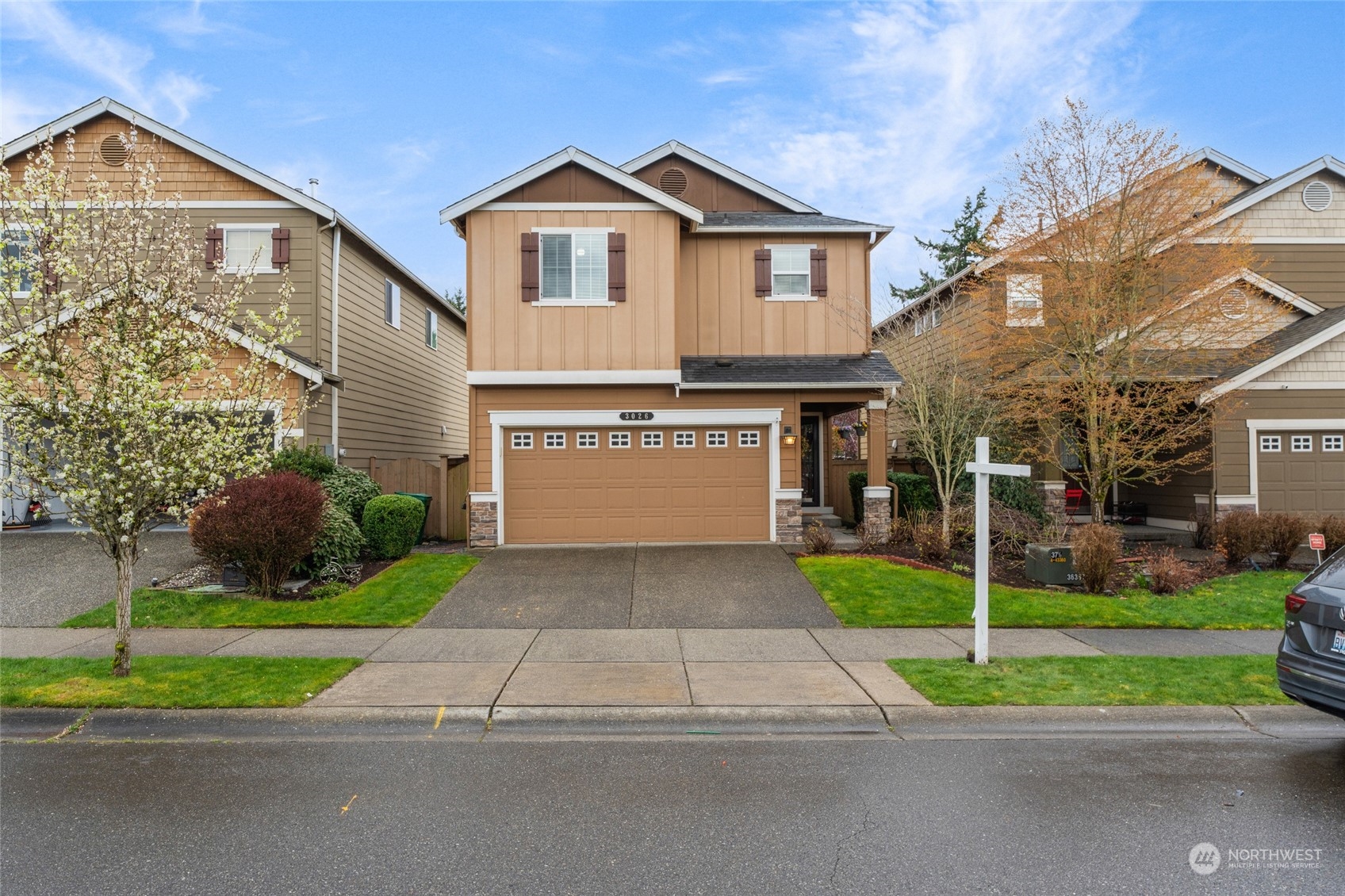 3026 183rd Street Southeast Bothell, WA 98012 - Photo 2 of 39 a front view of a house with a yard and garage