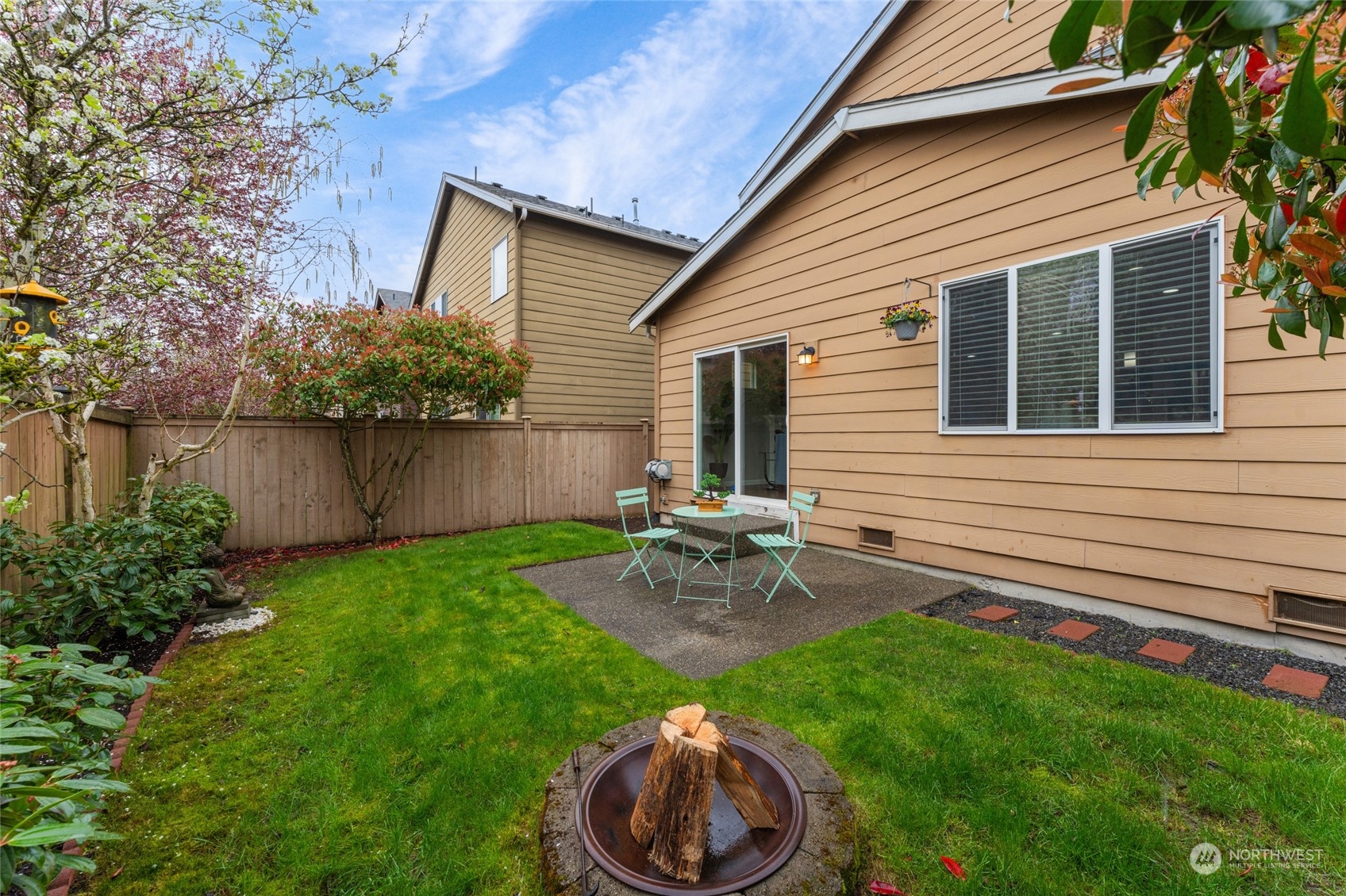 3026 183rd Street Southeast Bothell, WA 98012 - Photo 33 of 39 a view of a backyard with table and chairs and potted plants