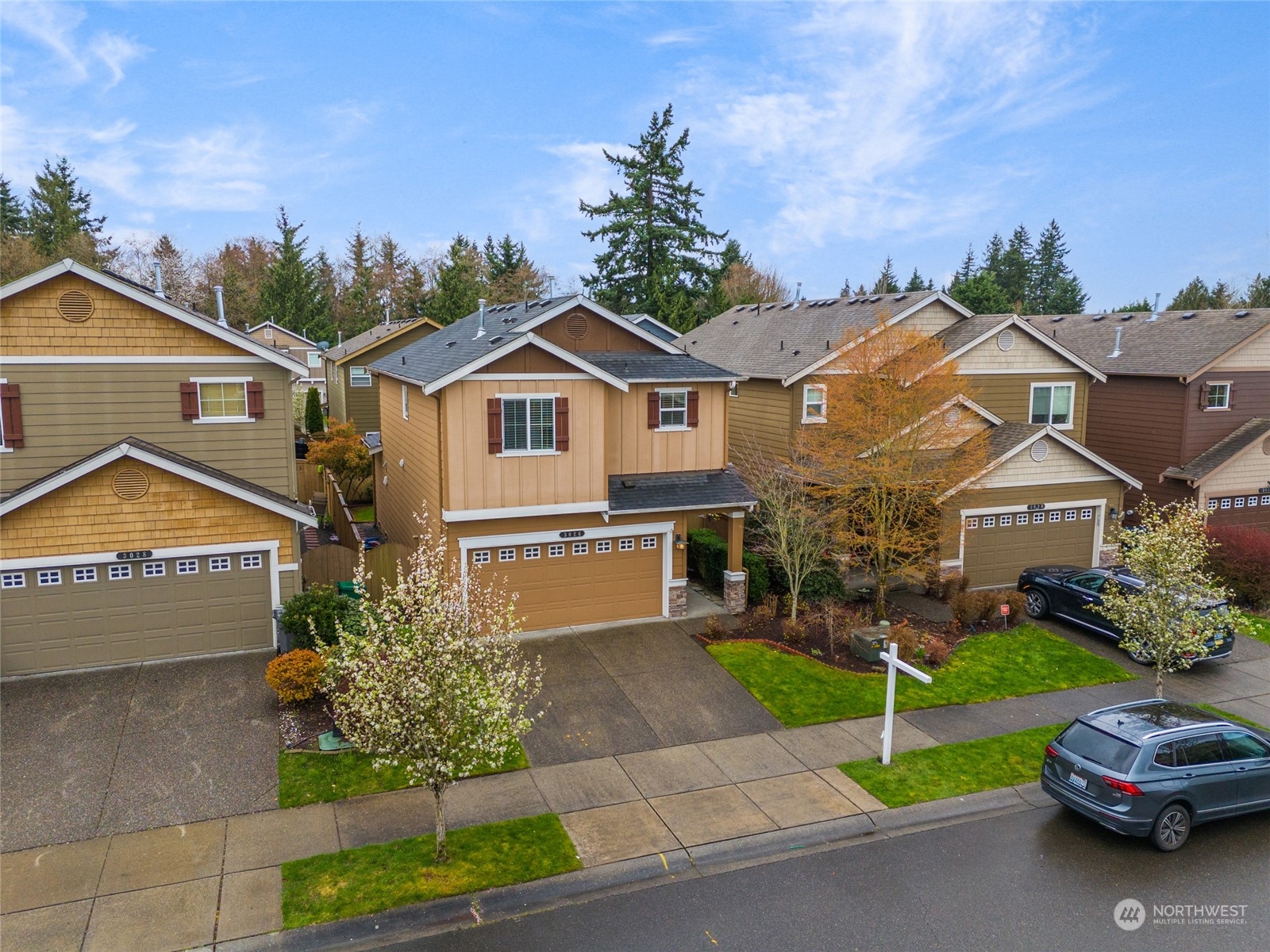 3026 183rd Street Southeast Bothell, WA 98012 - Photo 34 of 39 a front view of a house with a garden and plants