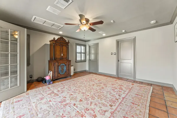 a bedroom with a bed closet and a window